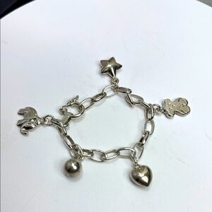 (Z4) Vintage bracelet with 5 mixed silver charms, size 7 large and solid